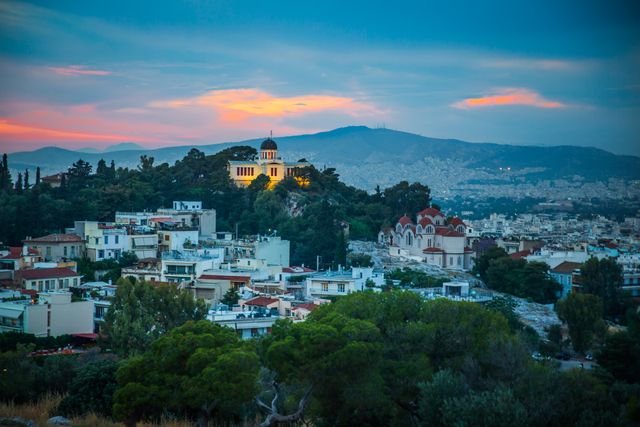 Athens hillside at sunset with the National Observatory and city view